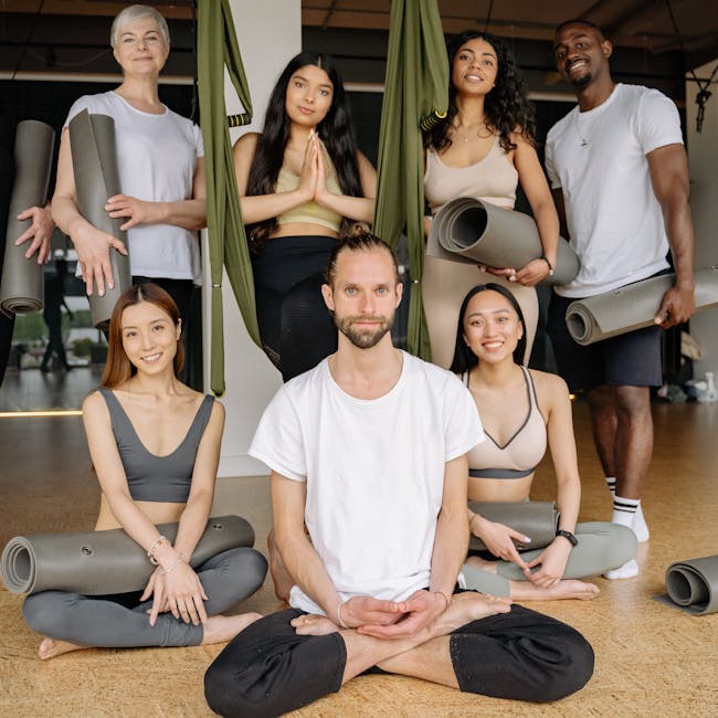 Diverse group of people smiling during a calm moment after yoga